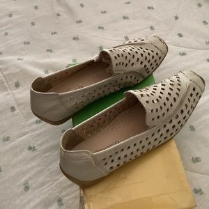 Beige soft flat leather shoes made with holes, a little worn